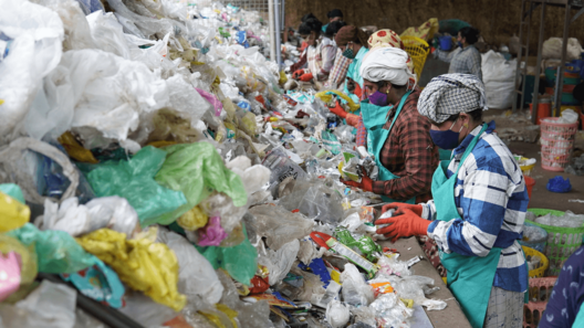 Clean Hub press photo: Women sorting the collected plastic waste